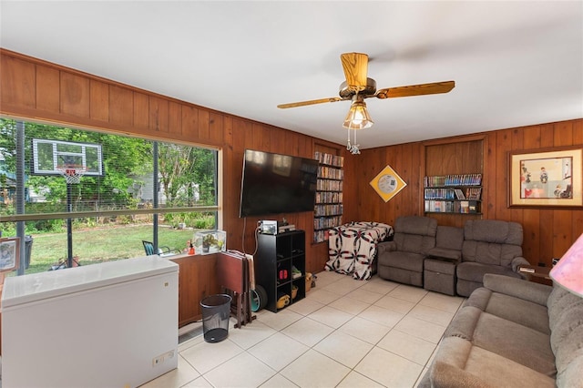 716 S Franklin Pl, Lakeland, FL 33815 - living area featuring wood walls, light tile patterned floors, and a ceiling fan