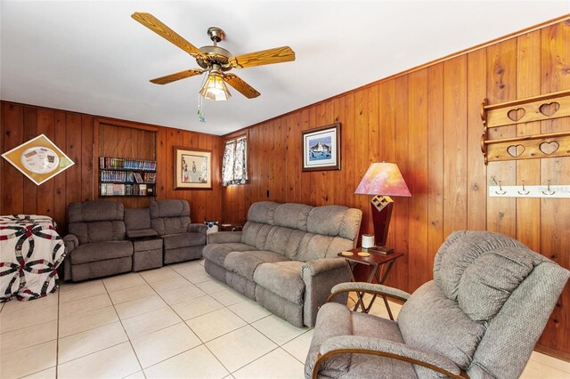 716 S Franklin Pl, Lakeland, FL 33815 - living room with light tile patterned floors, ceiling fan, and wood walls