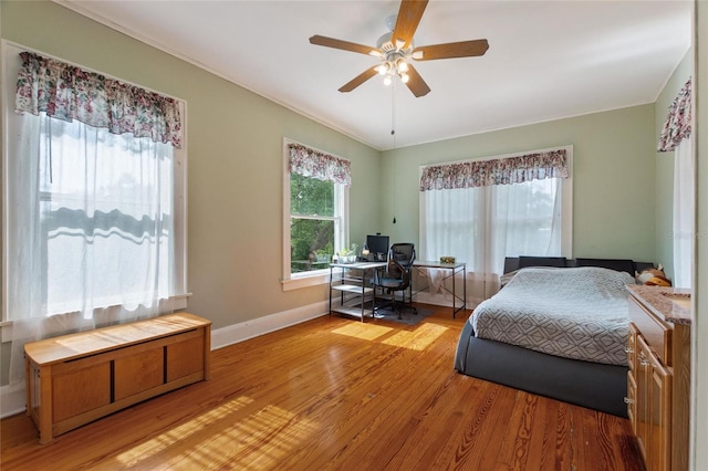 716 S Franklin Pl, Lakeland, FL 33815 - bedroom with an office area, light wood finished floors, baseboards, crown molding, and ceiling fan