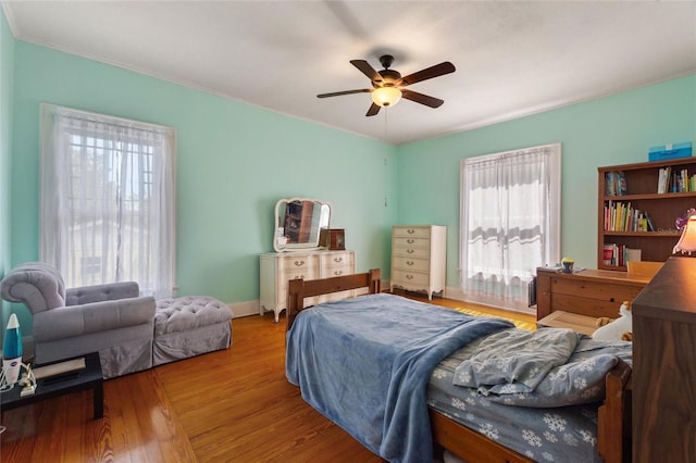 716 S Franklin Pl, Lakeland, FL 33815 - bedroom with wood finished floors and ceiling fan