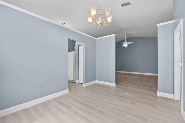 6086 Swallow Dr, Lakeland, FL 33809 - spare room with a ceiling fan, a chandelier, wood finished floors, baseboards, and lofted ceiling