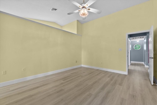 6086 Swallow Dr, Lakeland, FL 33809 - empty room featuring a ceiling fan, light wood-type flooring, baseboards, and lofted ceiling