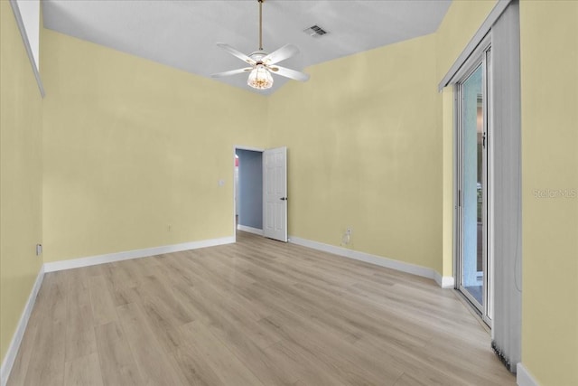 6086 Swallow Dr, Lakeland, FL 33809 - empty room with light wood finished floors, ceiling fan, baseboards, and vaulted ceiling