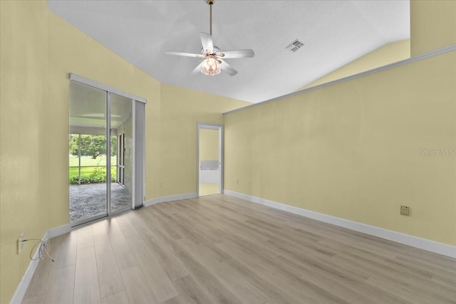 6086 Swallow Dr, Lakeland, FL 33809 - empty room with light wood finished floors, a ceiling fan, lofted ceiling, and baseboards