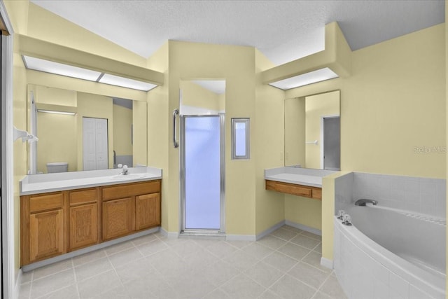6086 Swallow Dr, Lakeland, FL 33809 - bathroom featuring a bath, a stall shower, tile patterned floors, a textured ceiling, and vanity