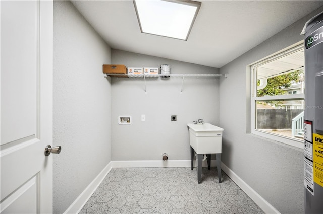 clothes washing area with washer hookup, hookup for an electric dryer, and baseboards