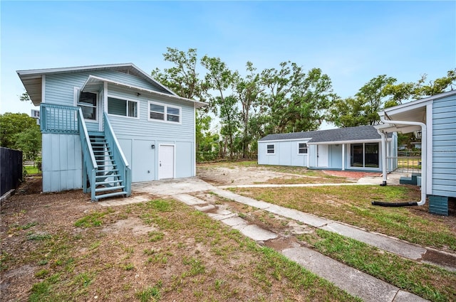 back of property with stairs