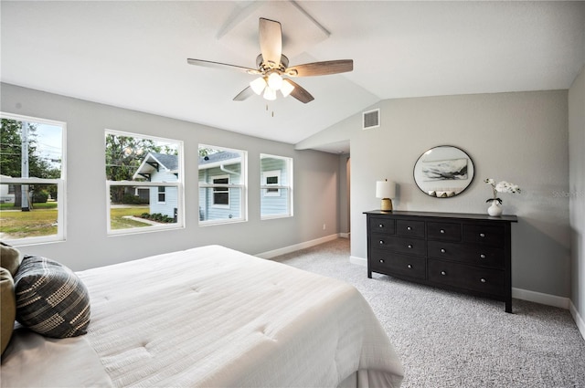 bedroom with baseboards, lofted ceiling, ceiling fan, and light colored carpet