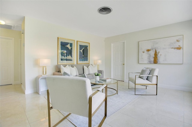 living room featuring light tile patterned flooring and baseboards