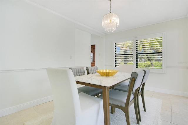 dining space featuring a chandelier, crown molding, baseboards, and light tile patterned floors