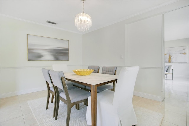 dining area with a chandelier, light tile patterned floors, crown molding, and baseboards