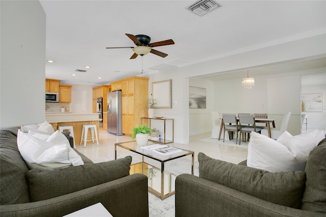living area with recessed lighting, a ceiling fan, and crown molding