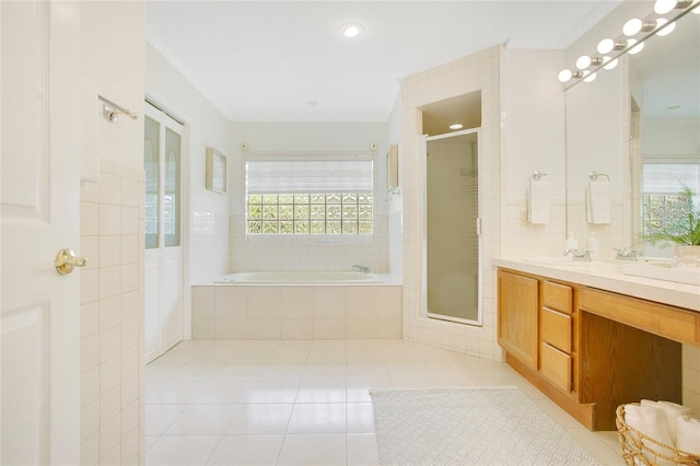 full bathroom featuring tile patterned floors, a bath, a stall shower, vanity, and recessed lighting