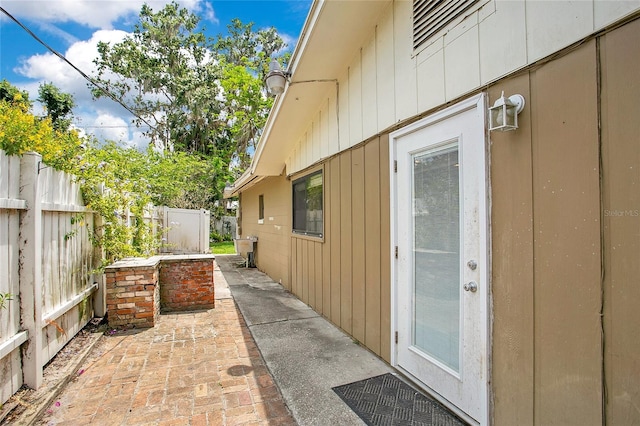 view of home's exterior featuring fence and a patio
