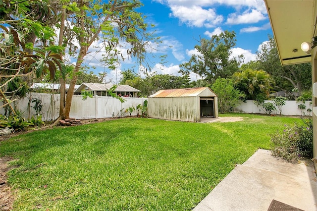 view of yard with a shed and an outbuilding