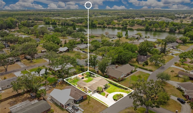 aerial perspective of suburban area featuring a nearby body of water and property boundaries highlighted