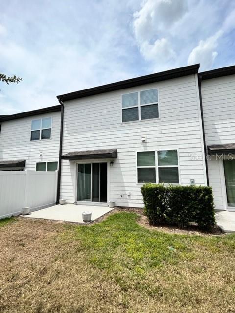 879 Grandin St, Davenport, FL 33837 - back of property featuring a patio area