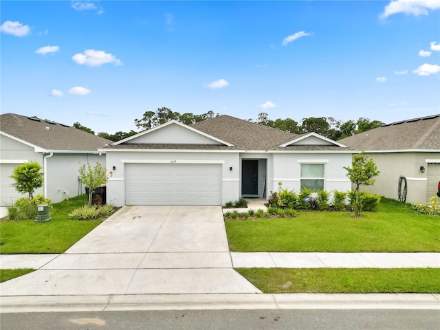 2039 Rosewood Cir, Lakeland, FL 33810 - ranch-style home featuring an attached garage, concrete driveway, a front lawn, and stucco siding