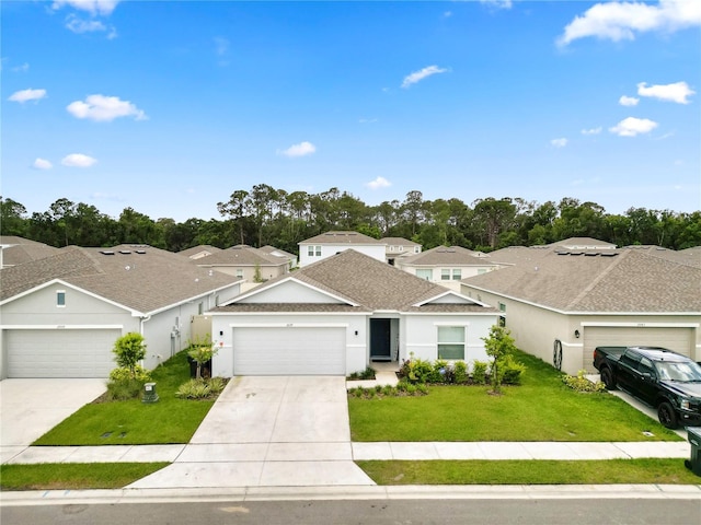2039 Rosewood Cir, Lakeland, FL 33810 - traditional-style home with a front yard, concrete driveway, stucco siding, and an attached garage