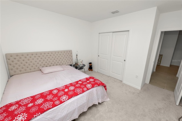 2039 Rosewood Cir, Lakeland, FL 33810 - carpeted bedroom featuring a closet and baseboards