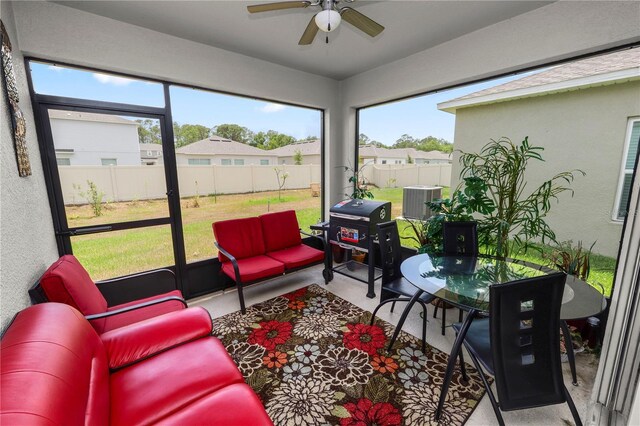 2039 Rosewood Cir, Lakeland, FL 33810 - sunroom featuring outdoor lounge area, a ceiling fan, and plenty of natural light