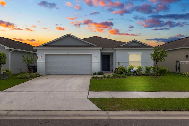 2039 Rosewood Cir, Lakeland, FL 33810 - ranch-style house with a garage, a front lawn, stucco siding, and concrete driveway