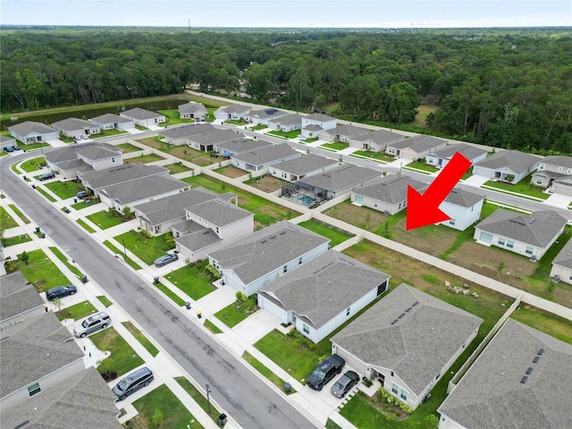 2039 Rosewood Cir, Lakeland, FL 33810 - aerial perspective of suburban area featuring a heavily wooded area