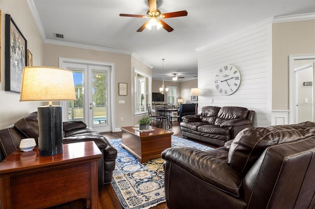 8909 N Campbell Rd, Lakeland, FL 33810 - living area with a ceiling fan, dark wood-style flooring, ornamental molding, and french doors