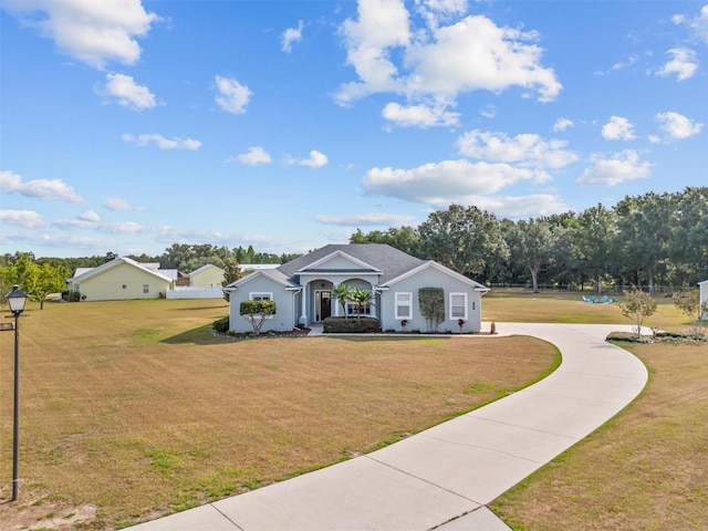 8909 N Campbell Rd, Lakeland, FL 33810 - single story home featuring a front yard and curved driveway