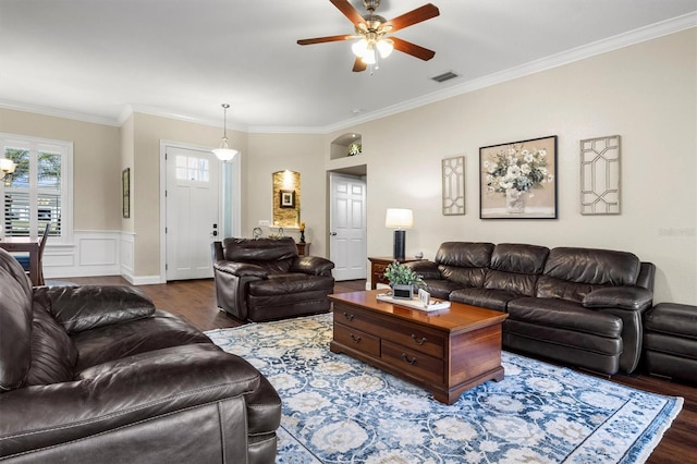 8909 N Campbell Rd, Lakeland, FL 33810 - living room featuring wood finished floors, crown molding, and a ceiling fan