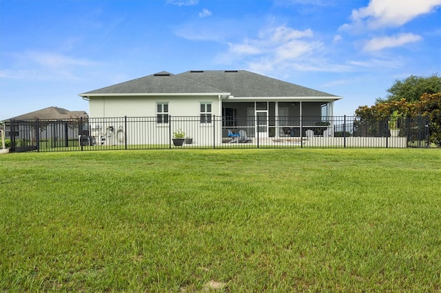 8909 N Campbell Rd, Lakeland, FL 33810 - back of property featuring a sunroom, stucco siding, and a shingled roof
