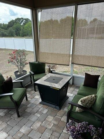 sunroom with an outdoor living space