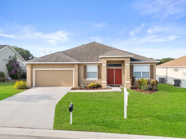 4041 Byrds Crossing Dr, Lakeland, FL 33812 - view of front of home featuring a garage, stucco siding, concrete driveway, and a front lawn