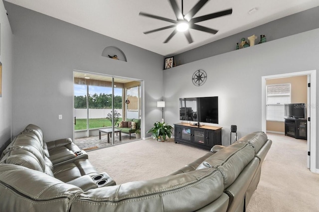 4041 Byrds Crossing Dr, Lakeland, FL 33812 - living area with light colored carpet, ceiling fan, high vaulted ceiling, and healthy amount of natural light