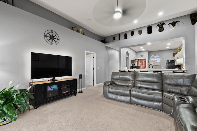 4041 Byrds Crossing Dr, Lakeland, FL 33812 - living area with light carpet, ceiling fan, recessed lighting, baseboards, and arched walkways