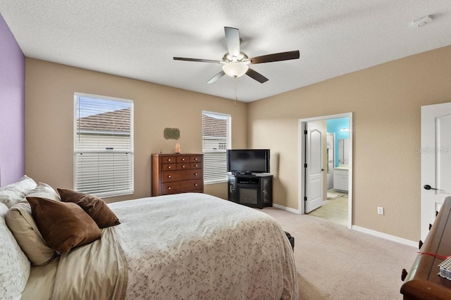4041 Byrds Crossing Dr, Lakeland, FL 33812 - bedroom featuring light colored carpet, baseboards, a ceiling fan, ensuite bathroom, and a textured ceiling