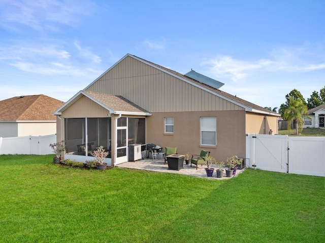 4041 Byrds Crossing Dr, Lakeland, FL 33812 - rear view of property featuring a gate, a sunroom, and a patio area