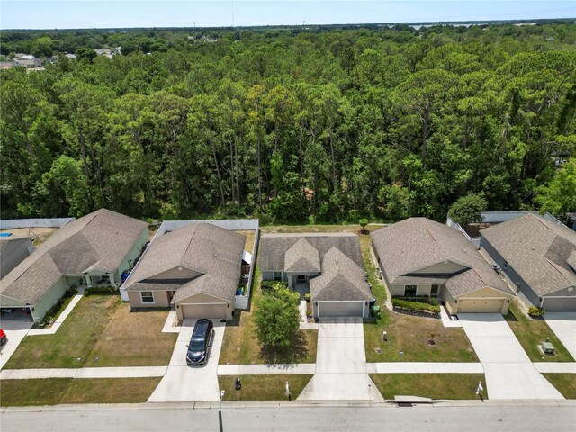1825 Wallace Manor Ln, Winter Haven, FL 33880 - aerial view of residential area featuring a forest