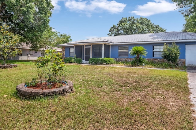 120 Bolender Rd, Auburndale, FL 33823 - ranch-style home featuring a sunroom, stucco siding, a front yard, and metal roof