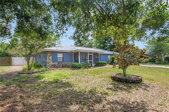 120 Bolender Rd, Auburndale, FL 33823 - ranch-style house featuring a sunroom, metal roof, and stone siding