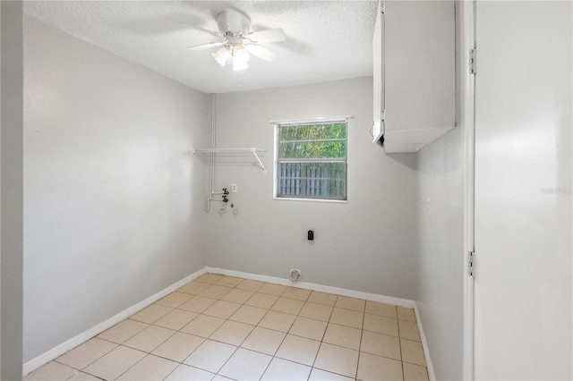 120 Bolender Rd, Auburndale, FL 33823 - laundry area featuring hookup for an electric dryer, a textured ceiling, ceiling fan, cabinet space, and baseboards