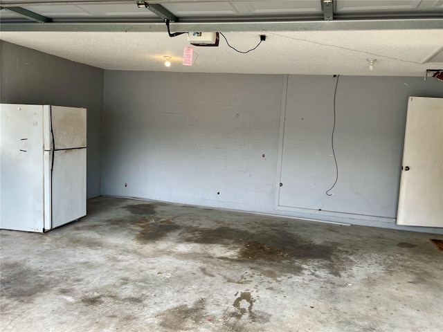 4038 Lehman Ln, Lakeland, FL 33813 - garage with freestanding refrigerator and a garage door opener