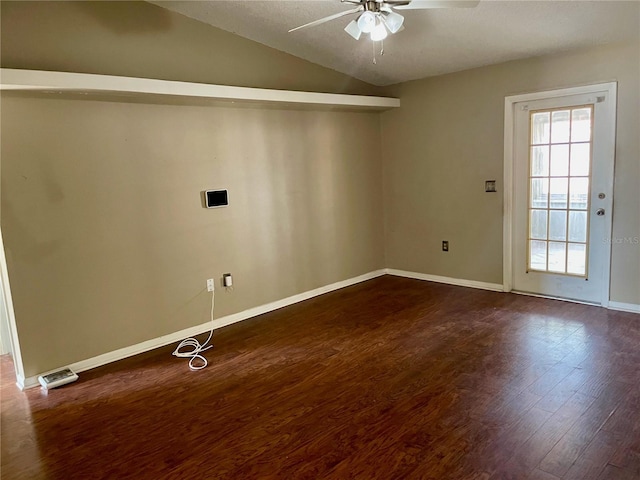 4038 Lehman Ln, Lakeland, FL 33813 - spare room featuring ceiling fan, dark wood-style flooring, vaulted ceiling, and baseboards