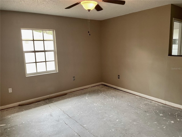 4038 Lehman Ln, Lakeland, FL 33813 - unfurnished room with ceiling fan, baseboards, and a textured ceiling
