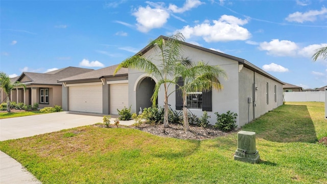 2991 Flying Blackbird Rd, Bartow, FL 33830 - view of front of house with stucco siding, a garage, and concrete driveway
