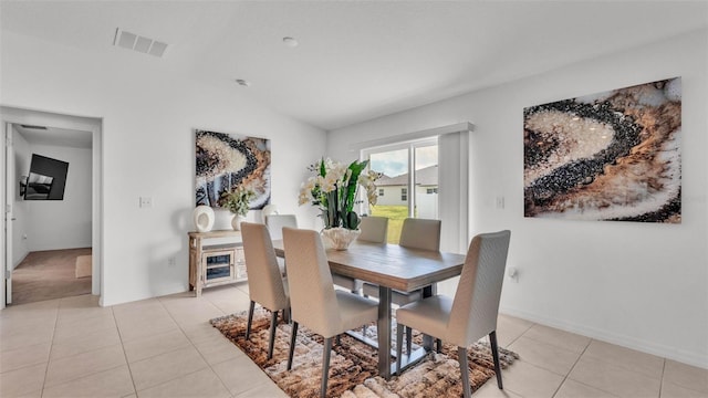 2991 Flying Blackbird Rd, Bartow, FL 33830 - dining space featuring lofted ceiling, light tile patterned floors, and baseboards