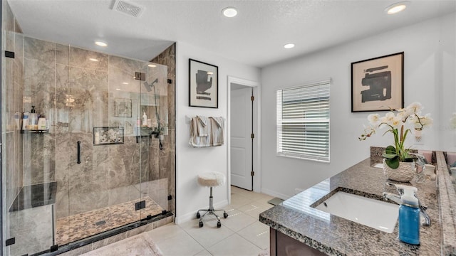 2991 Flying Blackbird Rd, Bartow, FL 33830 - full bathroom with tile patterned flooring, double vanity, baseboards, a stall shower, and recessed lighting