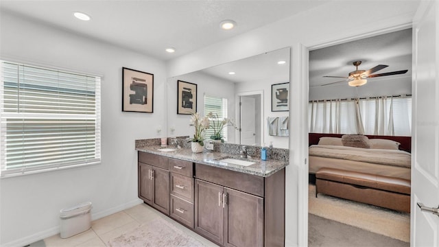 2991 Flying Blackbird Rd, Bartow, FL 33830 - ensuite bathroom featuring double vanity, tile patterned flooring, ceiling fan, baseboards, and recessed lighting