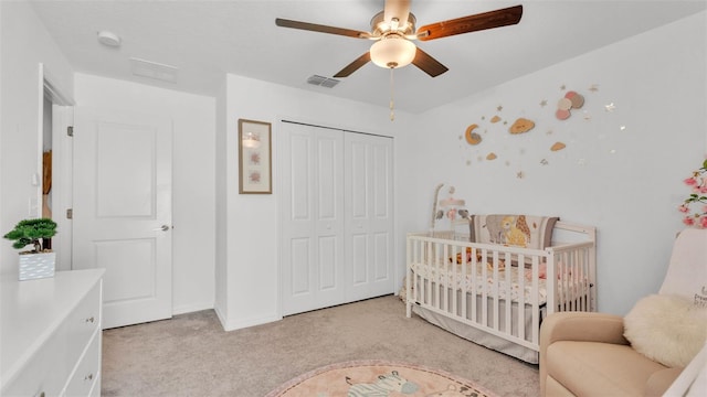 2991 Flying Blackbird Rd, Bartow, FL 33830 - bedroom with light carpet, a closet, a nursery area, and a ceiling fan