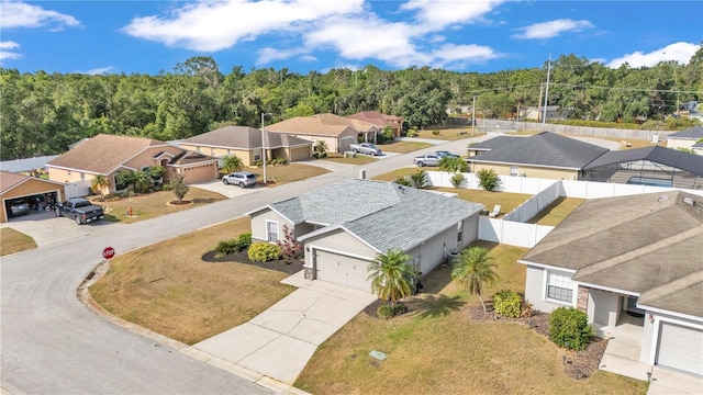 aerial perspective of suburban area with a heavily wooded area